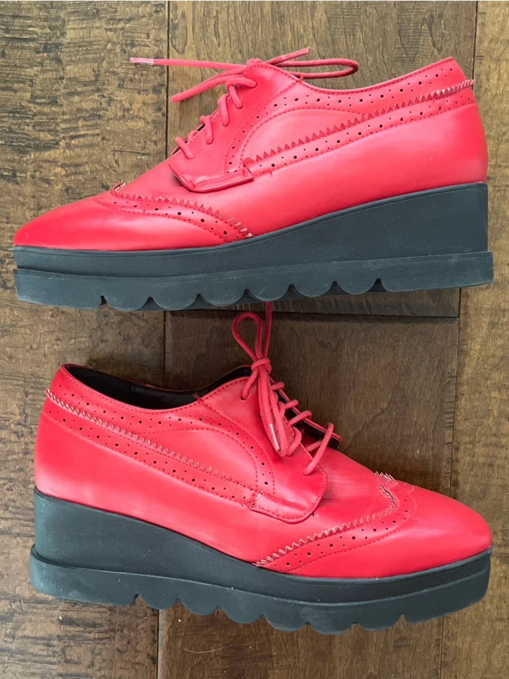 Red faux leather lace up lug wingtip derbies with platform rubber lug soles